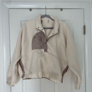 Free people fleece pullover with buttons. White and mauve color block